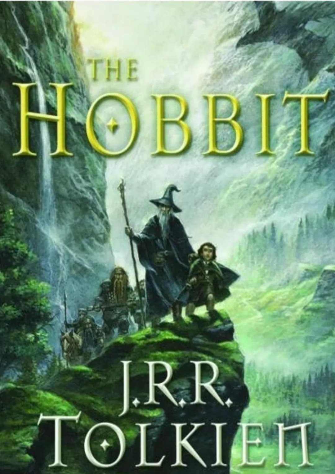 # THE

# HOBBIT

# J.R.R.

# TOLKIEN # Hobbit

Tam iz Powrotem

J.R.R. Tolkien

Akcja powieści rozgrywa się w Trzeciej Epoce
Śródziemia.

Mi